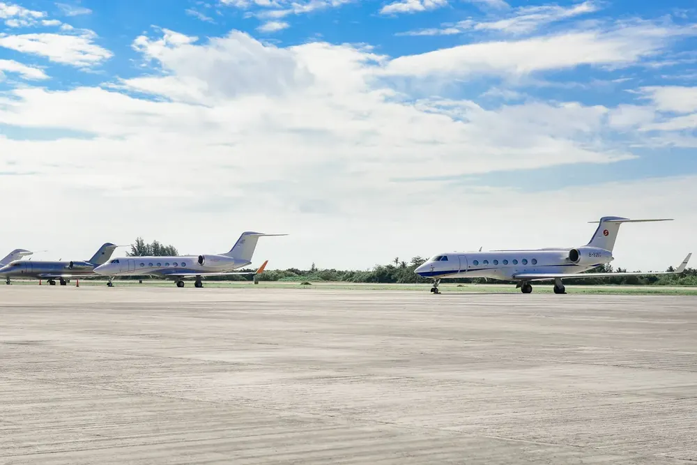 Business jets parked on an airport ramp